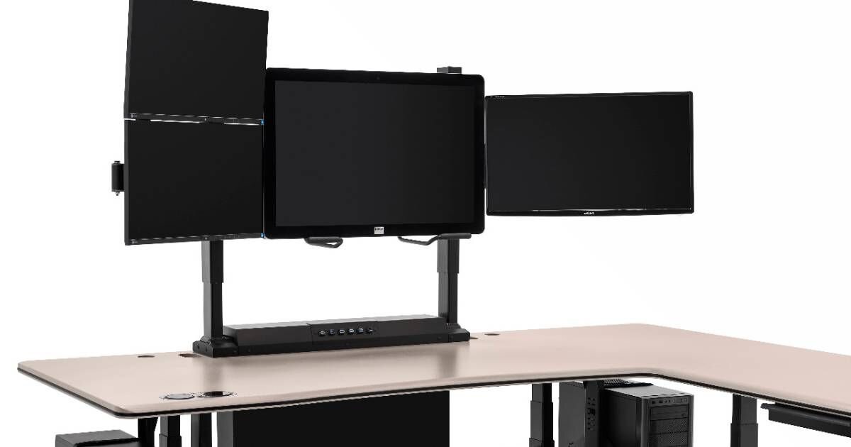 sit to stand workstation with multi monitor setup 